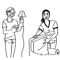 caitlin holding lamp and Amanda pointing to chair