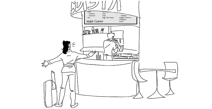 Amanda standing in front of coffee bar, apparently happy